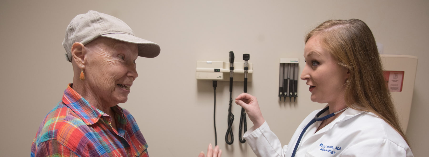 Female doctor and patient engage in discussion.